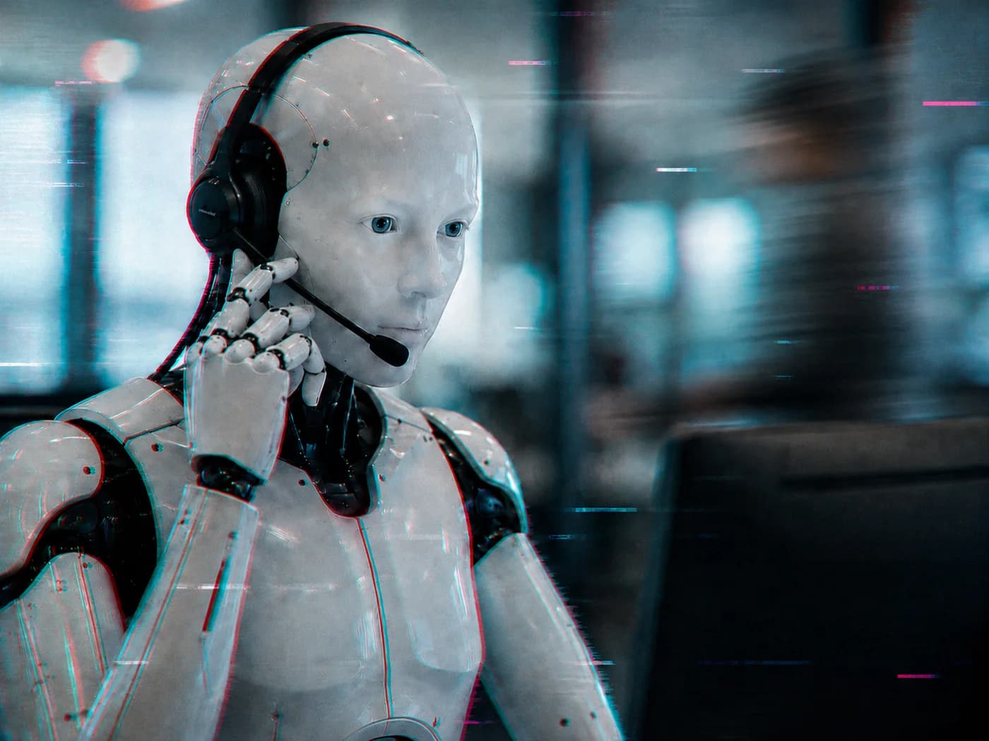 Humanoid figure in a headset taking a call at a contact center station